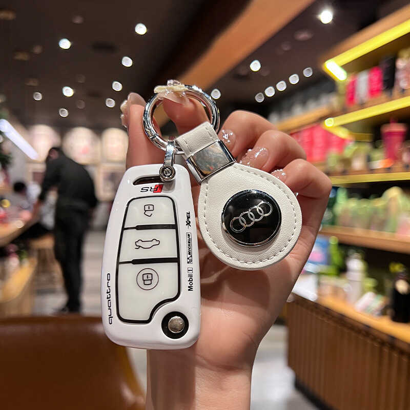 ทุ่มเท 2024 Audi q3 ฝาครอบกุญแจ q2l/Q7 ชาย 20 a3 เก่า A6 กระเป๋ารถพับหัวเข็มขัด Shell Track