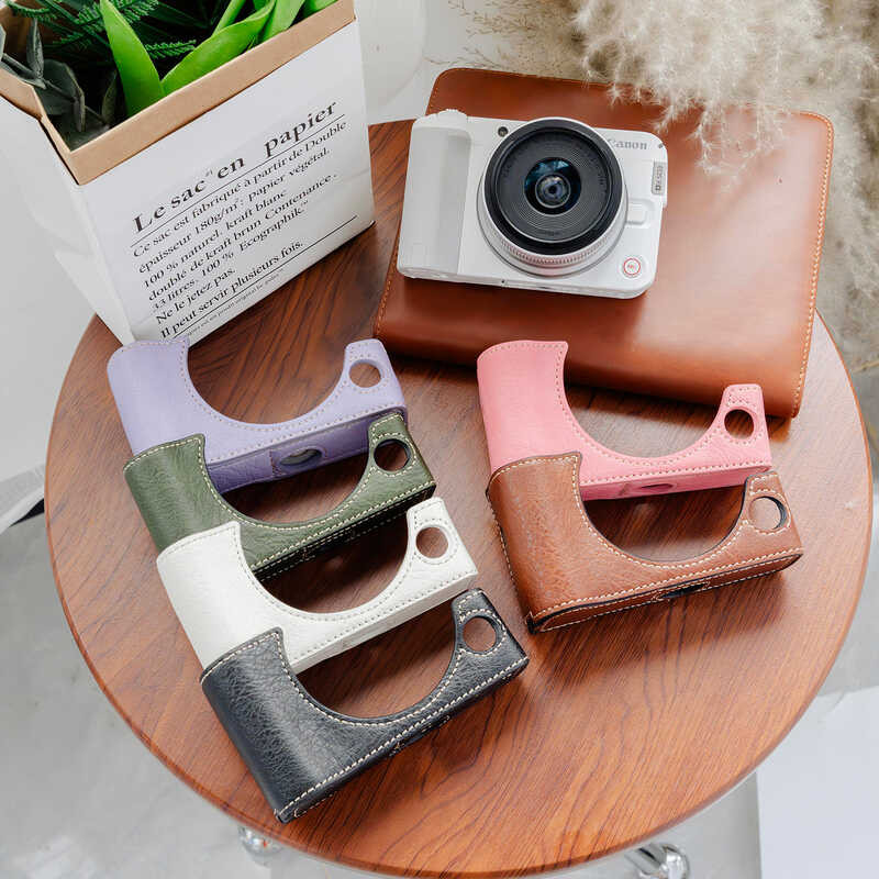 Canon r50v เคสป้องกัน v1 กระเป๋ากล้อง r10r62r7 เคสป้องกัน r100r50r8rpr52 เคสหนังอุปกรณ์เสริม