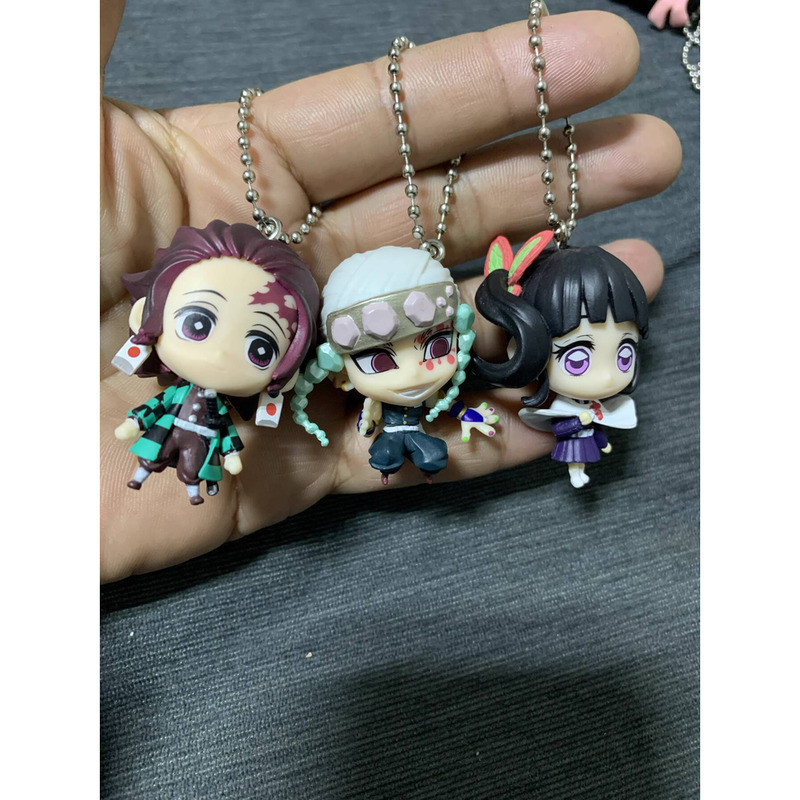{ของเล่นสดใส} สินค้าจํานวนมากของแท้ Bandai Demon Slayer ระเบิดที่สาม Tanjiro Tomioka Tomioka จี้กระเ