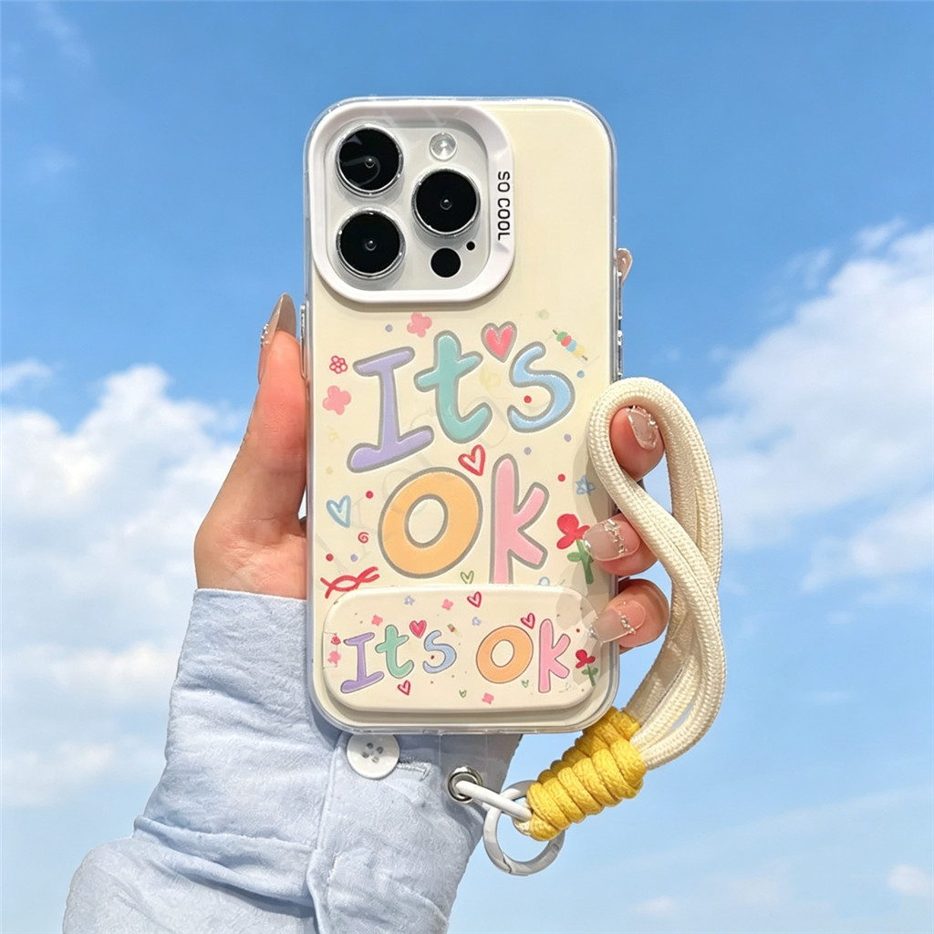 น่ารัก "เป็น OK" Pastel Doodle Design กันกระแทก Anti-Drop ปกอ่อนสําหรับ iPhone 17 16 15 14 Pro Max เคสโทรศัพท์พร้อมขาตั้งและเชือกเส้นเล็ก