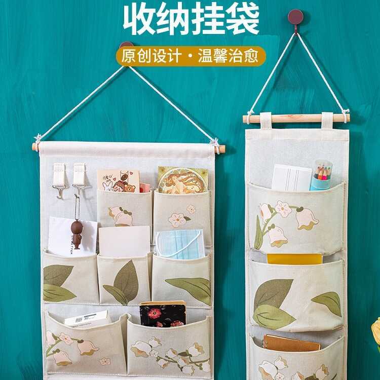 กระเป๋าแขวนเก็บของหลังประตู @ ผ้า Lily of the Valley แขวนผนังชั้นวางโทรศัพท์มือถือสินค้าหอพักตู้เสื้