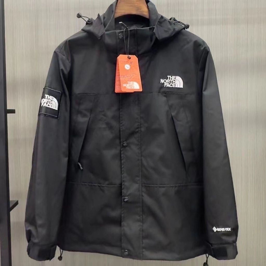 The North Face เสื้อแจ็คเก็ตกันลมแบบบางสไตล์ Unisex 1990 พร้อมเย็บปักถักร้อยกันลมและกันน้ํา