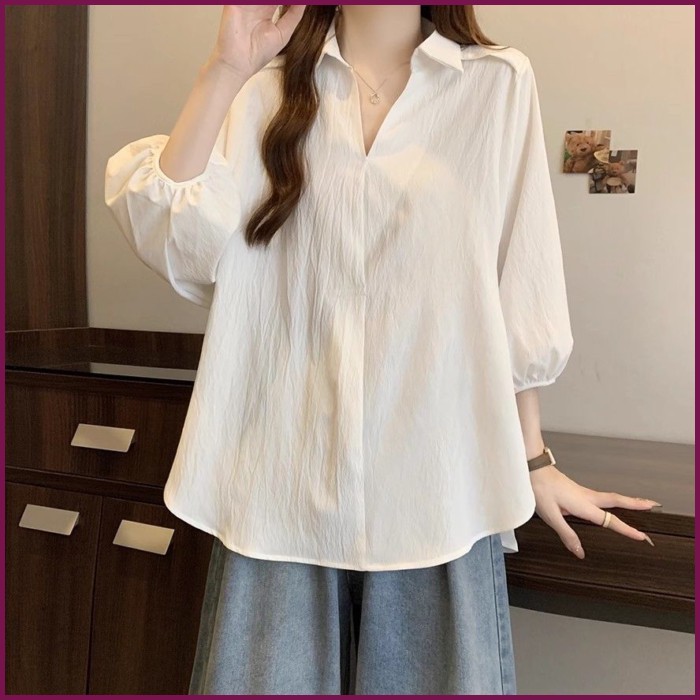 เสื้อเชิ้ตสีขาวแขนสามส่วน ทรงหลวม ไหล่ตรง เกาหลี ฮ่องกงดีไซน์ไม่สมมาตร เนื้อโพลีเอสเตอร์ปกปิดพุง2026