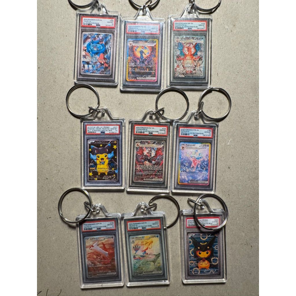 Pokemon KEYCHAIN handmade umbreon,pikachu,charizard,squirtle,latios,poncho,monic psa 10