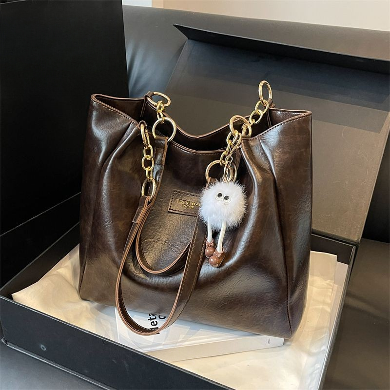 กระเป๋าโท้ทความจุขนาดใหญ่หญิง 2025 กระเป๋า ผู้สื่อสาร สไตล์ใหม่นักศึกษาวิทยาลัยชั้นพร็อพกระเป๋ากระเป๋าสะพาย - รูปที่ 2