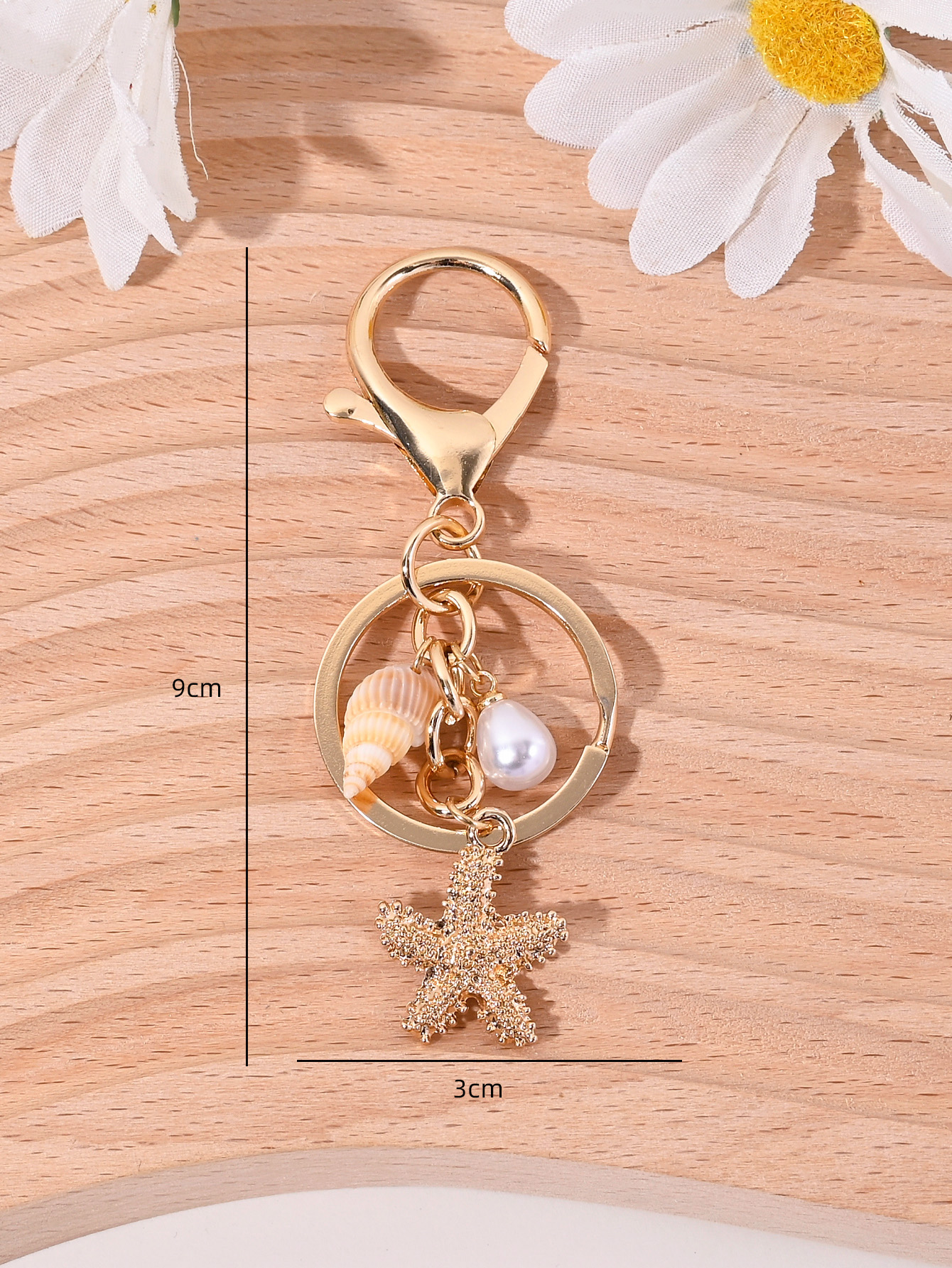สไตล์พักร้อนริมชายหาด พวงกุญแจจี้รูปปลาดาว หอยสังข์ ไข่มุกเทียม อุปกรณ์เสริมกระเป๋า พวงกุญแจรถ ของที่ระลึก เหมาะสําหรับทั้งผู้ชายและผู้หญิง (1 ชิ้น) - รูปที่ 6