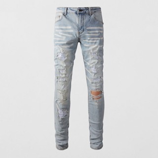 Amiri men blue denim slim fit jeans embellished with diamonds. #street style long pants