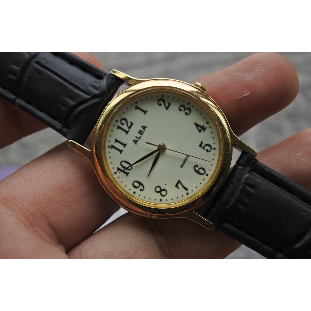 นาฬิกา Vintage มือสองญี่ปุ่น ALBA V121 K005 ระบบ QUARTZ ผู้ชาย ทรงกลม กรอบทอง หน้าปัดเรืองแสง หน้าปัด 34มม