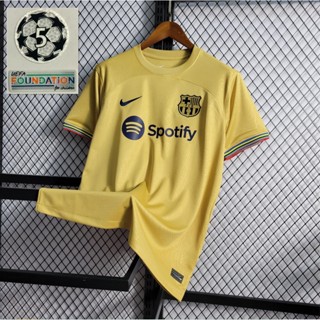 เสื้อกีฬาบาเซโลน่า | เสื้อยืด คุณภาพสูง ลาย RAR Away Gold 22-23