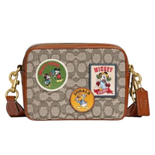 กระเป๋าสะพายข้าง Disney x Flight 19 In Signature Textile Jacquard With Patches CG968