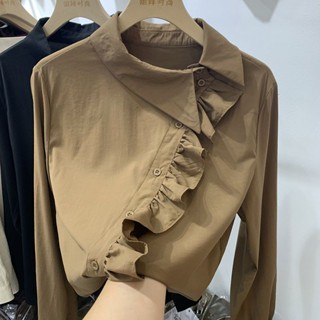 cintageshop official เสื้อเชิ้ตกระดุมแนวทแยงขอบระบายสำหรับผู้หญิงเสื้อเชิ้ตตัวนอกทรงหลวมสไตล์เกาหลีแบบใหม่ฤดูใบไม้ผลิและฤดูใบไม้ร่วงแขนยาวสำหรับผู้หญิงเสื้อเก๋ๆ