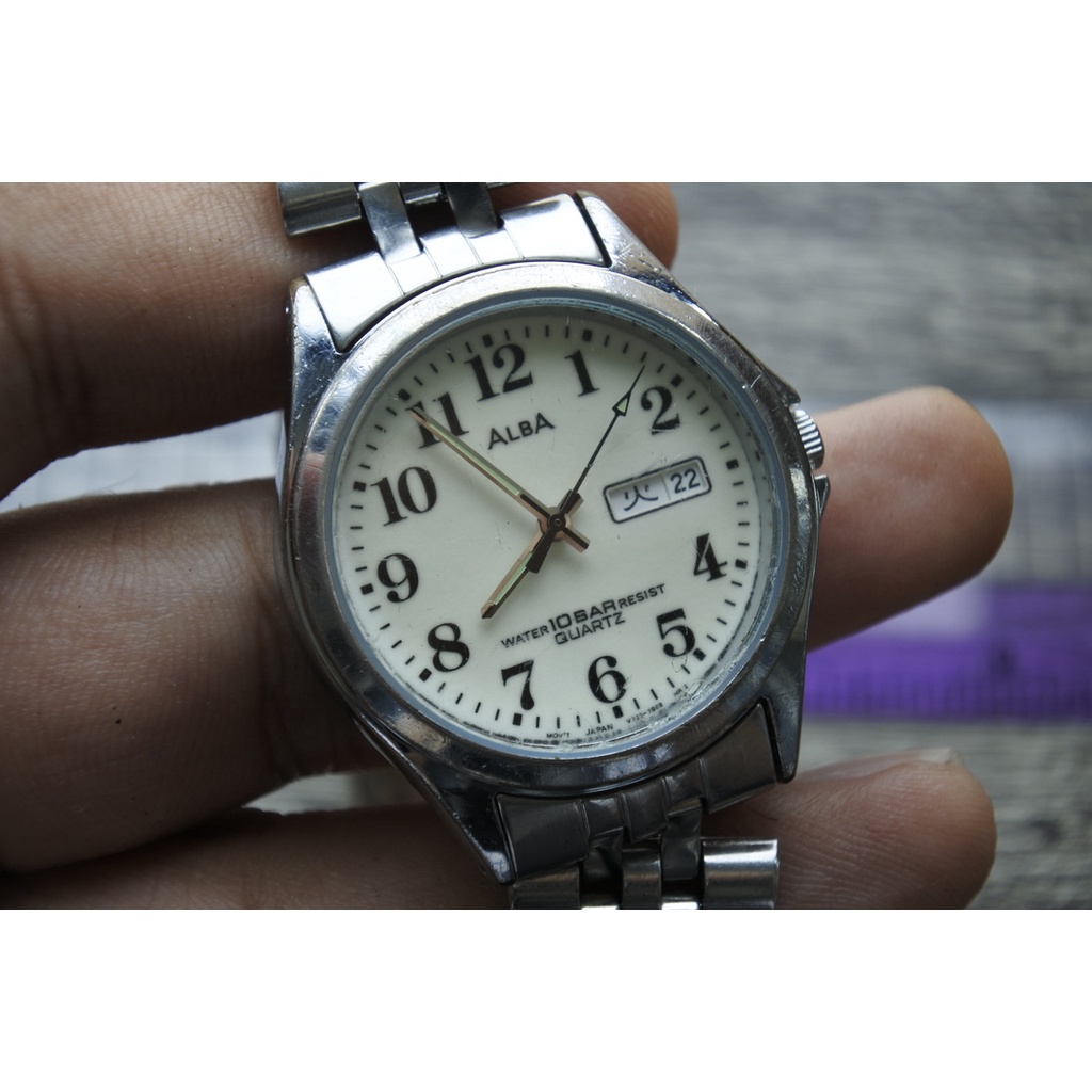 นาฬิกา Vintage มือสองญี่ปุ่น ALBA V733 7A70 ระบบ QUARTZ ผู้ชาย ทรงกลม กรอบเงิน หน้าขาว หน้าปัด35มม