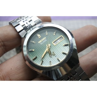 นาฬิกา Vintage มือสองญี่ปุ่น SEIKO ELNIX 0703 8040 ระบบ QUARTZ ผู้ชาย ทรงกลม กรอบเงิน หน้าปัดสีเขียว หน้าปัด37มม