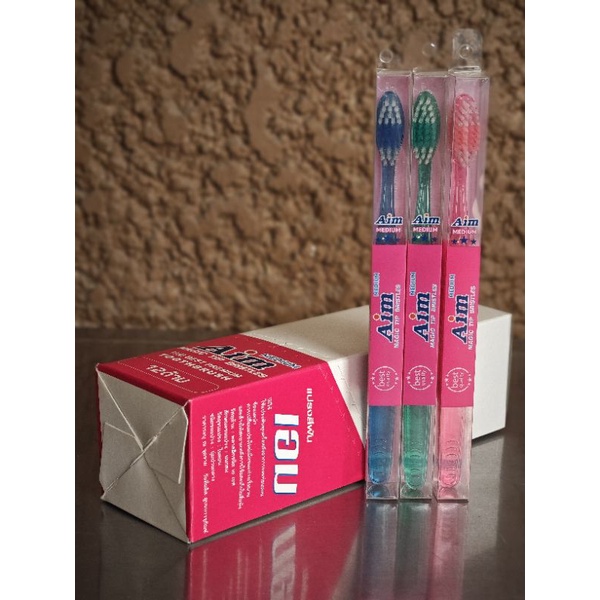 แปรงสีฟันเอม AIM Magic Tip Bristles กล่องใส ขนแปรง Medium (12ด้าม)