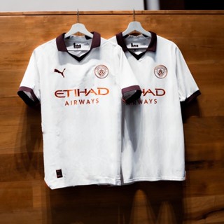 ชุดเยือนทีมเเมนเชสเตอร์ซิตี้ เกรดเเฟนบอล PUMA MANCHESTER CITY 2023/2024 AWAY REPLICA JERSEY - PUMA WHITE/AUBERGINE