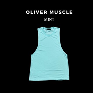 เสื้อกล้ามแขนกุดผู้ชายสีเขียวมิ้น ใส่ออกกำลังกาย ผ้านิ่ม ระบ…