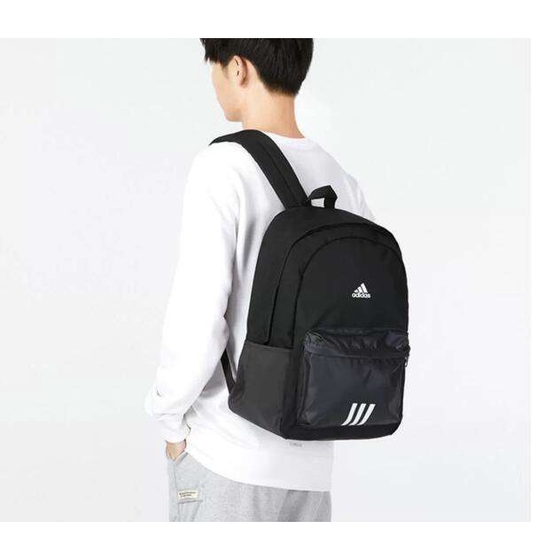 ☃✔Adidas Adidas กระเป๋าผู้ชายและผู้หญิงกระเป๋านักเรียนใหม่กระเป๋าเป้สะพายหลังเดินทางกลางแจ้ง HM9146 