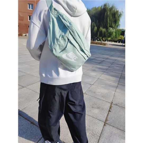 ☌NIKE กระเป๋าสะพายข้างสำหรับผู้ชายและผู้หญิงกีฬากลางแจ้งกระเป๋าสะพายไหล่กันน้ำ Wang Yibo สไตล์เดียวกันกระเป๋าคาดเอวความจ