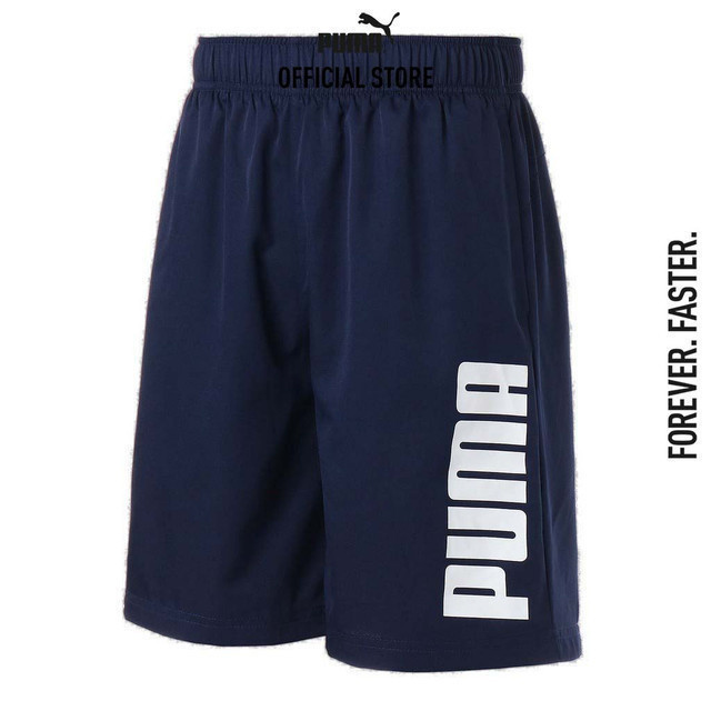 PUMA BASICS - กางเกงขาสั้นชาย Essentials Woven 9 นิ้ว สีฟ้า - 84721206