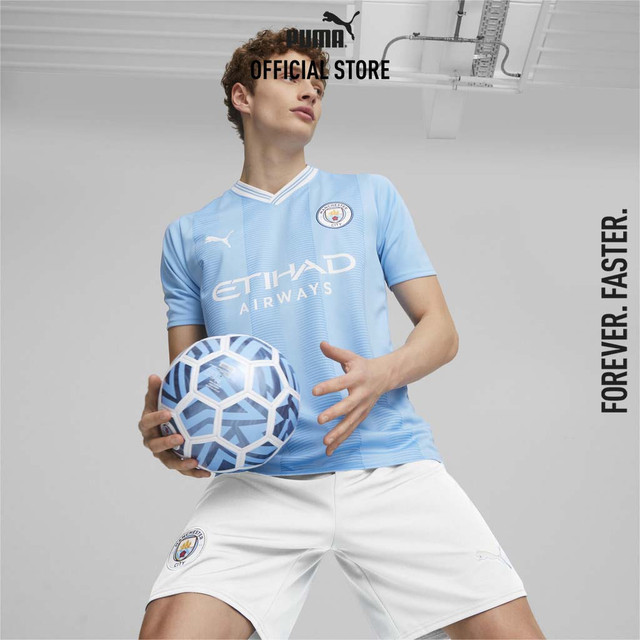 PUMA FOOTBALL - เสื้อชุดเหย้าของทีม Manchester City ฤดูกาล 23/24 เกรดแฟนบอล (Replica) สีฟ้า - 77043801