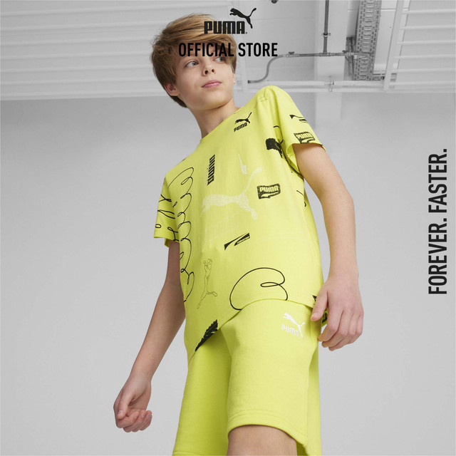 PUMA KIDS - เสื้อยืดเด็กโตพิมพ์ลายทั่วตัว CLASSICS BRAND LOVE สีเขียว 67996538