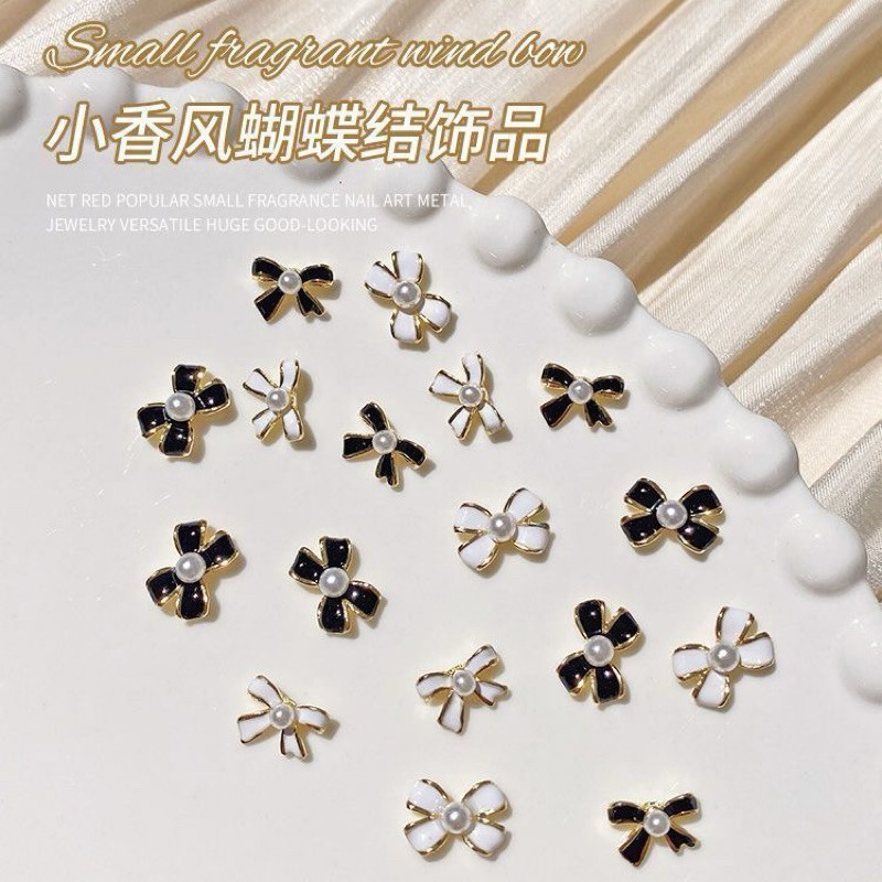 อะไหล่ติดเล็บโบว์หรูหราประดับมุข 10 ชิ้น 17 บาท