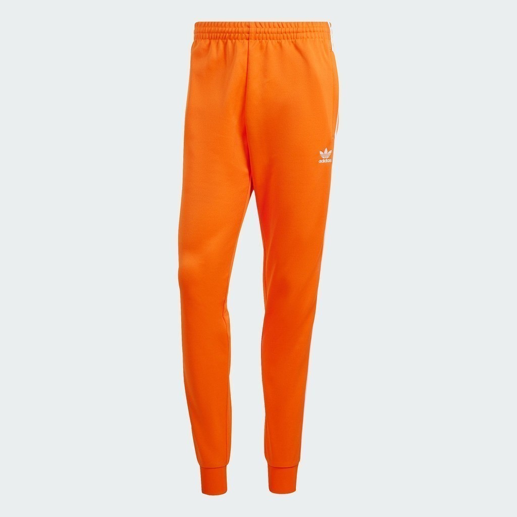 adidas ไลฟ์สไตล์ กางเกงแทรค Adicolor Classics SST ผู้ชาย สีส้ม IR9875