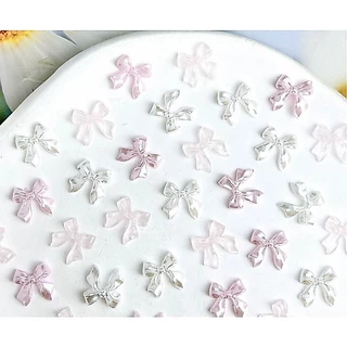 C2.โบว์หางยาวสีมุก🎀🤍 สำหรับตกแต่งเล็บ หนึ่งถุงมี 20 ตัวต่อสี🎀🤍🎀🤍🎀🤍