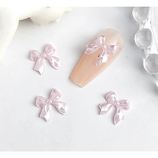 C2.โบว์หางยาวสีมุก🎀🤍 สำหรับตกแต่งเล็บ หนึ่งถุงมี 20 ตัวต่อสี🎀🤍🎀🤍🎀🤍