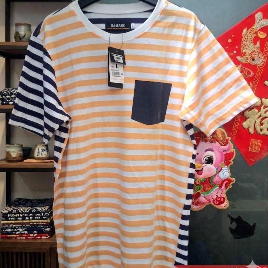 เสื้อยืดคอกลมแขนสั้นแบรนด์ BJ Jeans ลายทางสีส้มสลับขาว (SIZE.L)
