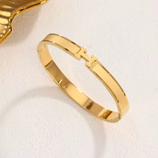 สร้อยข้อมือเหล็กไทเทเนียมเคลือบทอง 18k เครื่องประดับแฟชั่นระดับไฮเอนด์ไม่ซีดจาง