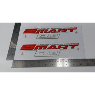 สติ๊กเกอร์ดั้งเดิม ติดกระจกแค็ป ด้านนอก คำว่า SMART CAB ULTIMATE ADVANCED STRUCTURE สำหรับรถ TOYOTA VIGO SMARTCAB ติดรถ