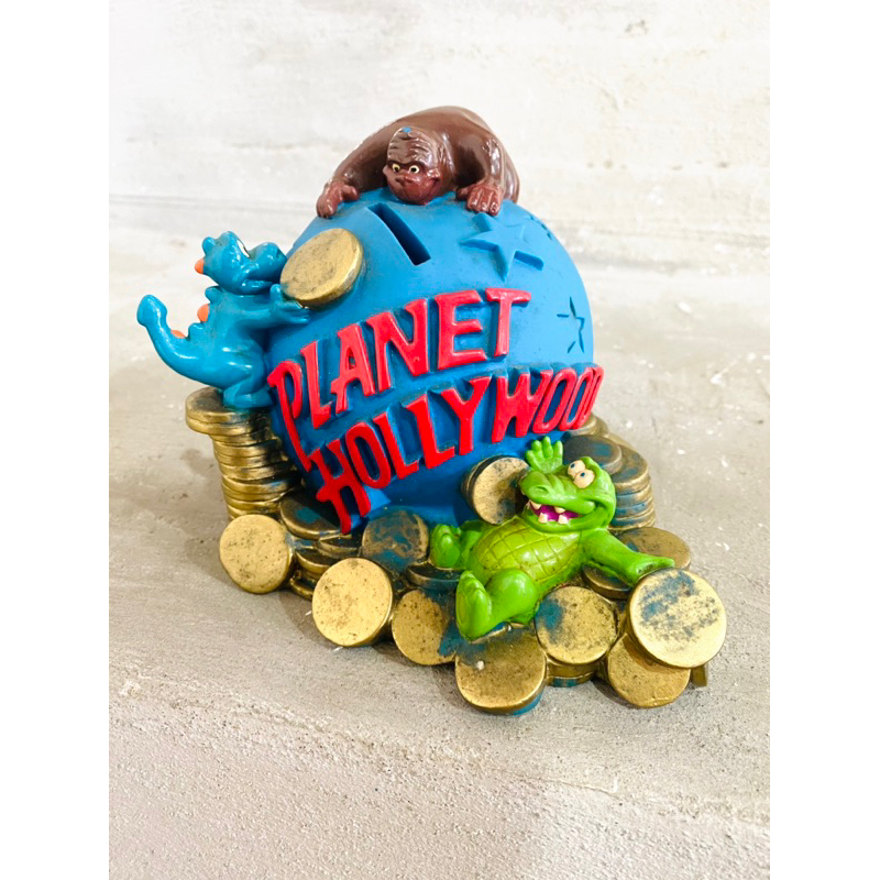 ของเล่น ของสะสม กระปุกออมสิน VINTAGE PLANET HOLLYWOOD  ราคา 500บาท