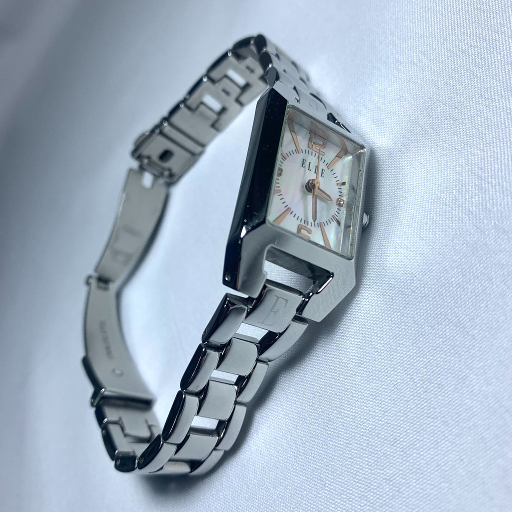 ELLEนาฬิกาควอทซ์ฝรั่งเศสแท้ตัวเรือนและสายสแตนเลสหน้าปัดมุกกรอบสีเงินสำหรับผู้หญิงเดินปกติแสดงเวลา3เข