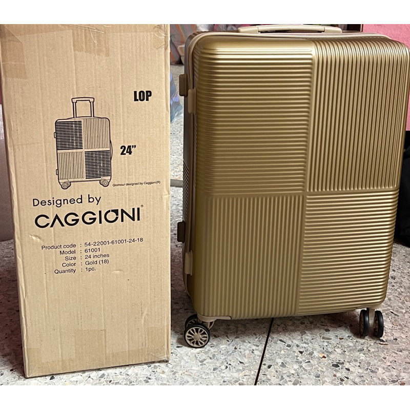 [มีรอยจากการขนส่ง]กระเป๋าเดินทาง 4 ล้อ อิสระ ยี่ห้อ  Caggioni ขนาด 24นิ้ว สี GOLD