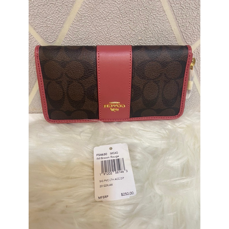กระเป๋าสตางค์ใบยาวCOACHสีชมพูตัดน้ำตาลลายตัวC