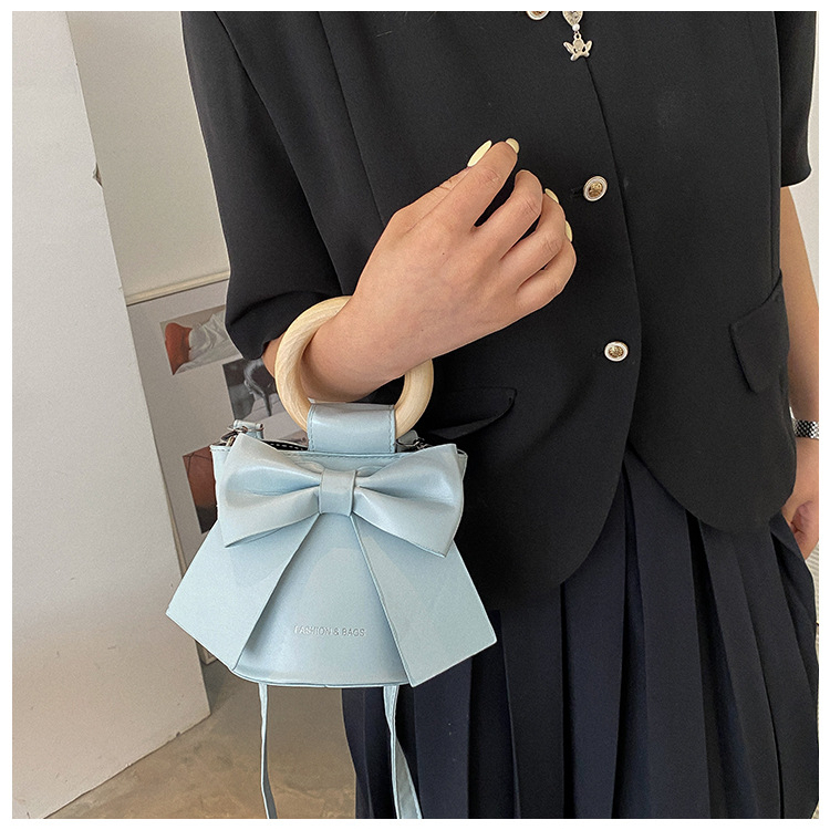 กระเป๋าหน้าโบว์   กระเป๋าสไตส์เกาหลีน่ารักหูจับไม้  เเบบใหม่ทรงถังสไตส์สาวหวาน - รูปที่ 4