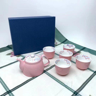 Japanese style pink cherry blossoms with a pot of five cups