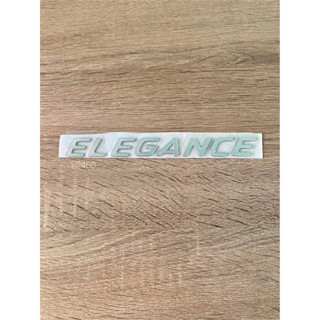 โลโก้ ELEGANCE ขนาด 19x2 cm. ติดท้ายMazda