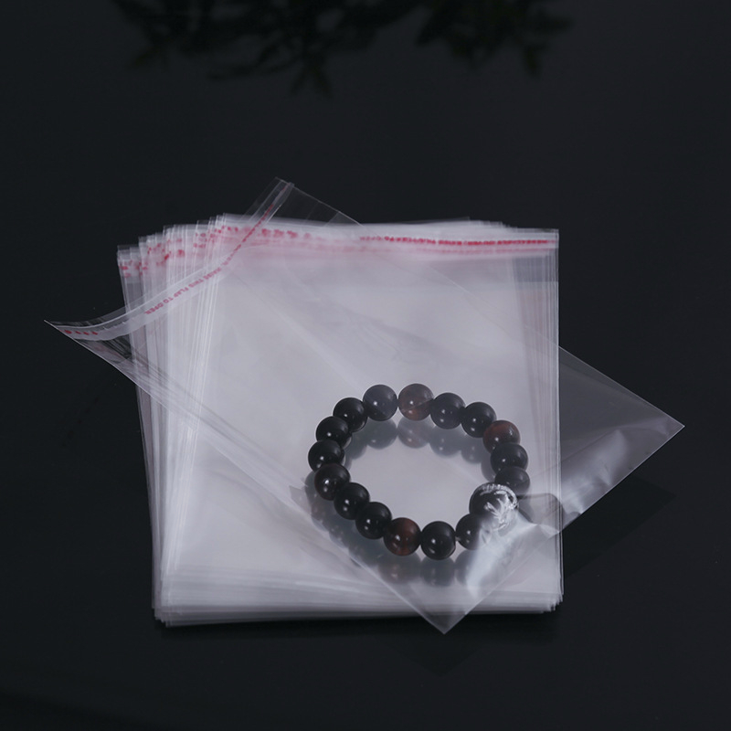 ถุงแก้วฝากาว 100ใบ สีโปร่งใส ฝาครอบกาวจะปิดผนึกตัวเอง เสื้อผ้า เครื่องประดับ และสิ่งของต่างๆ สามารถปิดผนึกได้ - รูปที่ 2