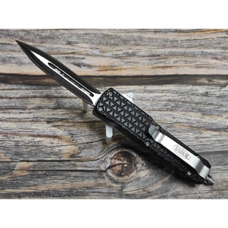 มีดสปริง ยี่ห้อ Microtech รุ่น Troodon เฉยๆ รุ่นหนึ่ง สำเนาจีน ขนาดไม่ยาวและไม่เล็กเกินไป ใบสองคม ใบสีดำด้ามดำอลูมิเนียม