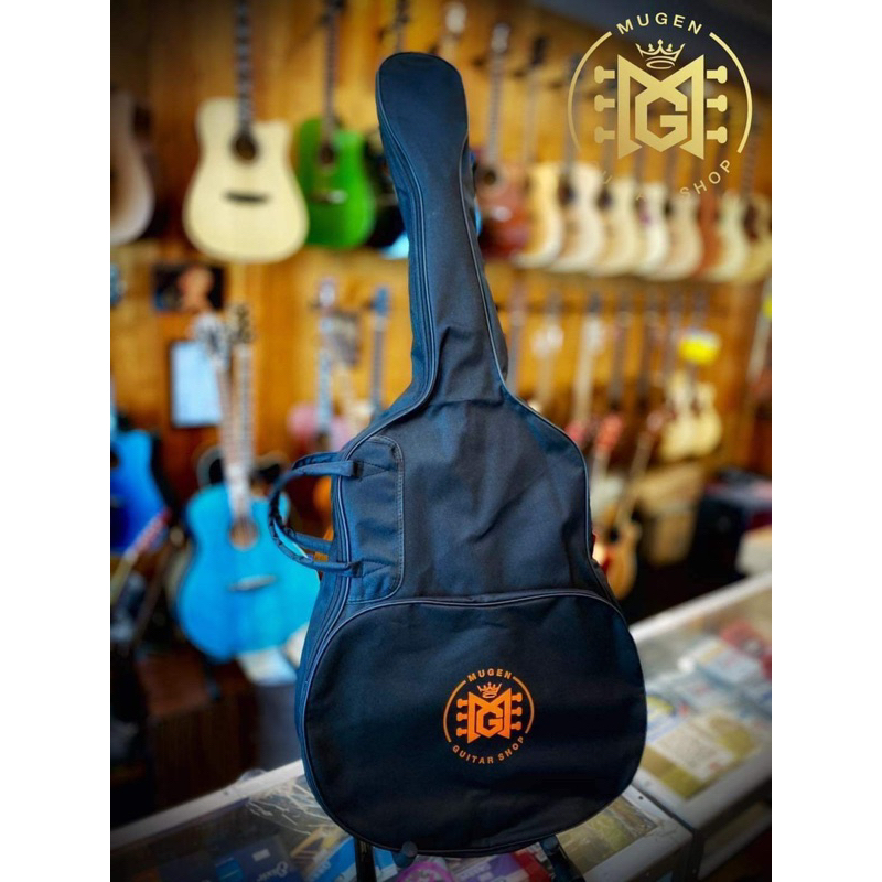 กระเป๋ากีตาร์โปร่งMugenguitarshop กันน้ำได้สบายในราคาเบาๆสามารถสะพายหลังได้ มีกระเป๋าหน้าใส่อุปกรณ์ให้