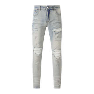 AMIRI light blue ripped patch micro elastic slim fit jeans