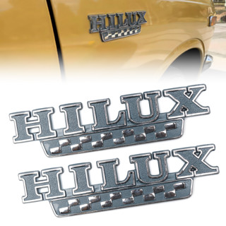 LOGO HILUX ติดข้างแก้ม แก้มข้าง รถยนต์ TOYOTA RN20 RN25 ปี 1972 - 1978 ขนาด 4.5 x 18 cm  สีดำ 1 คู่