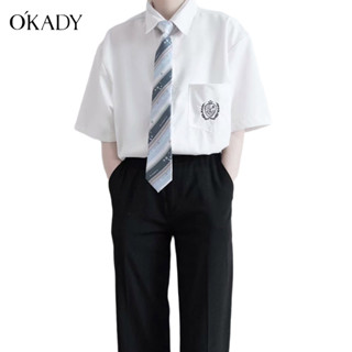 OKADY เสื้อเชิ้ตผู้ชายแฟชั่นสไตล์วิทยาลัยเสื้อเชิ้ตคู่รักแขนสั้นผ้าฝ้ายแท้สไตล์เกาหลีผูกคอหลวมสำหรับนักเรียน