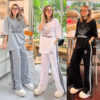 ชุดเซ็ต2ชิ้น ชุดสาวอวบ เสื้อยืดคอกลมแขนสั้นทรง oversize มาพร้อมกับกางเกงขายาว แต่งแถบ 3 เส้น มีกระเป๋าล้วงข้าง