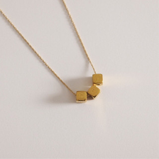 Chic appeal : Smiley Cube Necklace