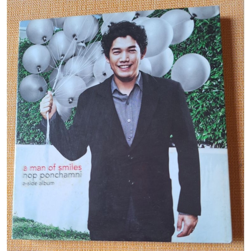 CD เพลง A Man of Smiles Nop Ponchamni มือ 2