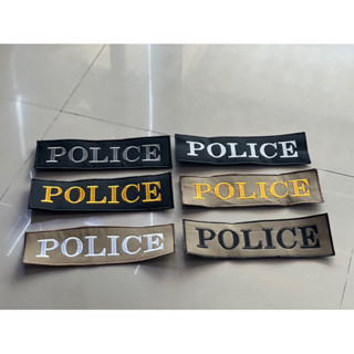 ป้ายด้านหลังปัก Police มี 6 สีตามภาพ
