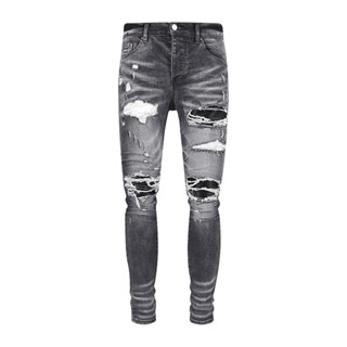 AMIRI wash holes do old patchwork MX1 stretch slim jeans